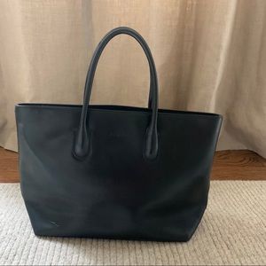 Black leather Furla tote 14 x 9 x 4. Zipper closur